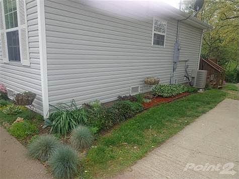 Side of home with beautiful landscape!