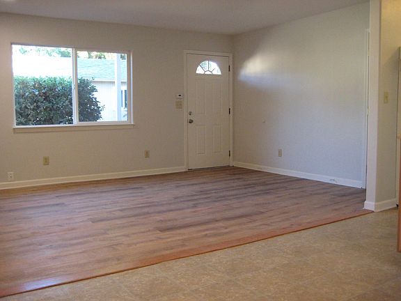 Living room with new, super-durable, plank floors are easy to keep clean. No vacuum cleaner required.