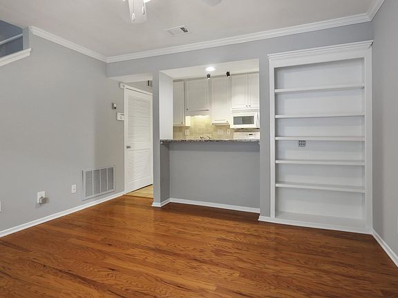 living Room with build in book case and bar area