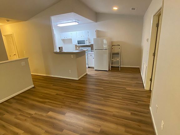 Living room looking at Dining area and kitchen