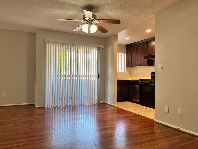 Large open concept living & dining space, with a private balcony