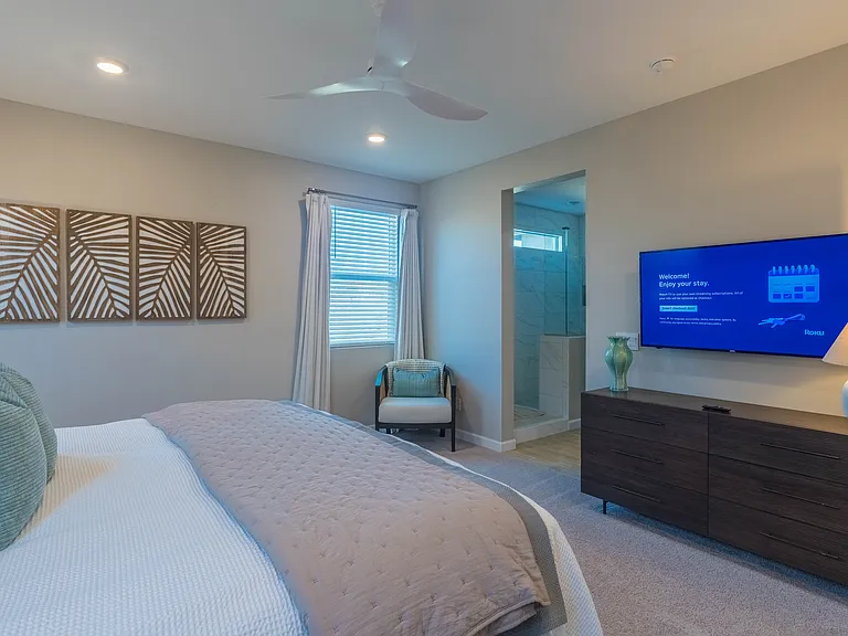 Serene primary bedroom with double dresser and huge walk in closet!