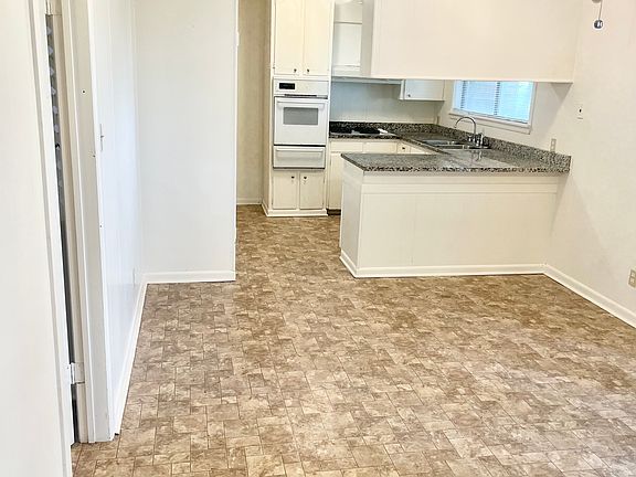 Open concept kitchen to a living area or dining area