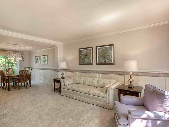The formal living & dining rooms have crown molding and wainscoting. The dining room has a coffered 