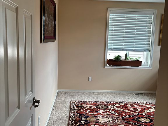 1st bedroom 
spacious and bright bedroom with large window, cozy carpet, and peaceful atmosphere. Perfect for rest, sleep, or focused work. Room easily fits a queen-size bed, nightstands, and a desk or dresser. Clean, quiet, and private.