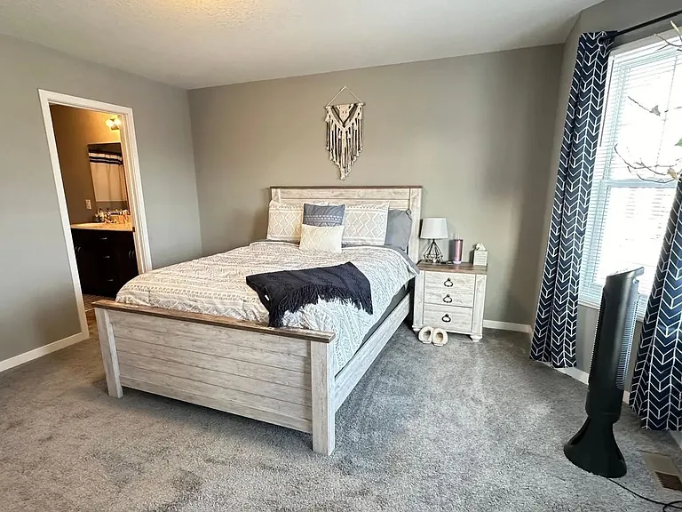 Elevate your living space at LS Capital Group with this beautifully designed bedroom, featuring plush carpeting and modern furnishings for ultimate comfort. Don't miss out on the opportunity to make this your new home. Explore more today!