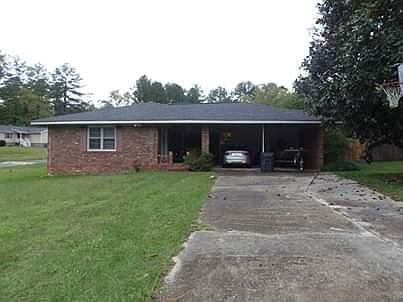 Front of house showing carport.