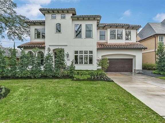 Enjoy the spacious front yard on this beautiful street in Bellaire.