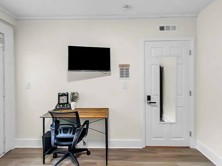 Dedicated workspace & wall-mounted television