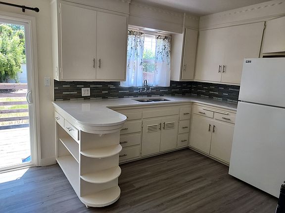 new countertop, backsplash, and floor