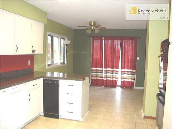 Large kitchen with Trash Compactor, Double Oven Dishwasher and Stove.