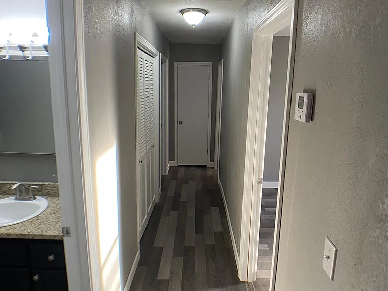 Hall with large closet and linen closet