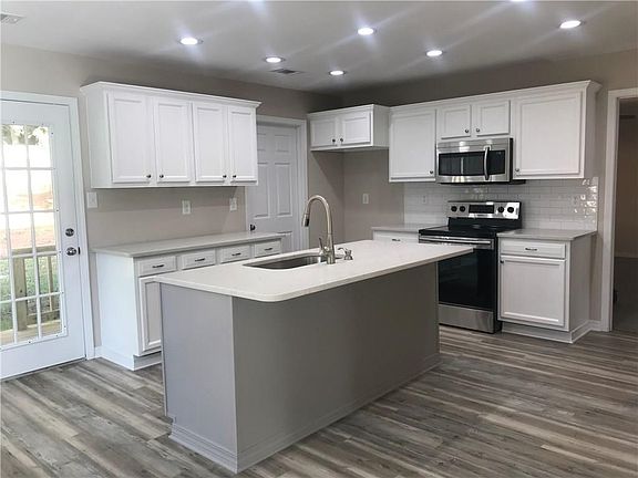 Beautiful kitchen with new island and quartz counter tops