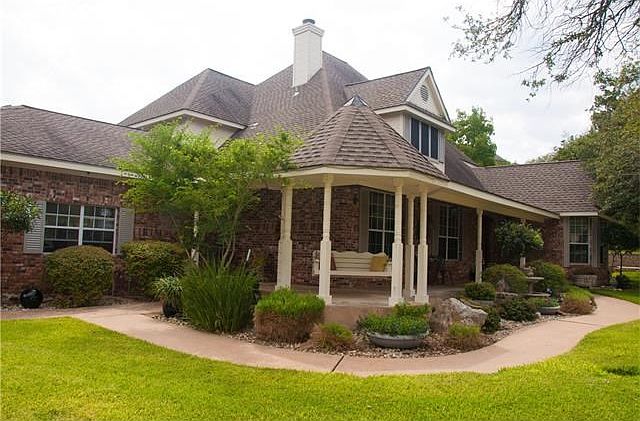 Enjoy the peace and quiet as you watch the family enjoy the yard from your porch swing.  Children riding bikes up and down the long drive.