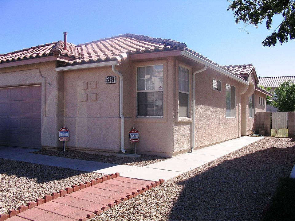 Front of house, rock landscaping.