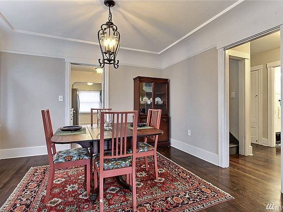 Formal dining room with sunny windows and plenty of space for bigger table, buffet, china cabinet
