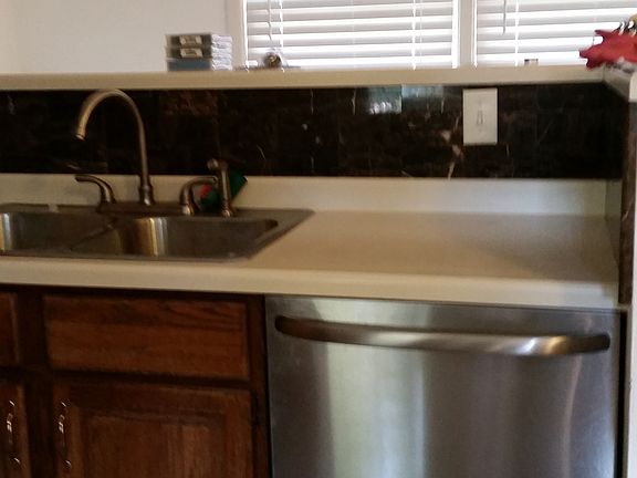 Kitchen features stainless steel appliances