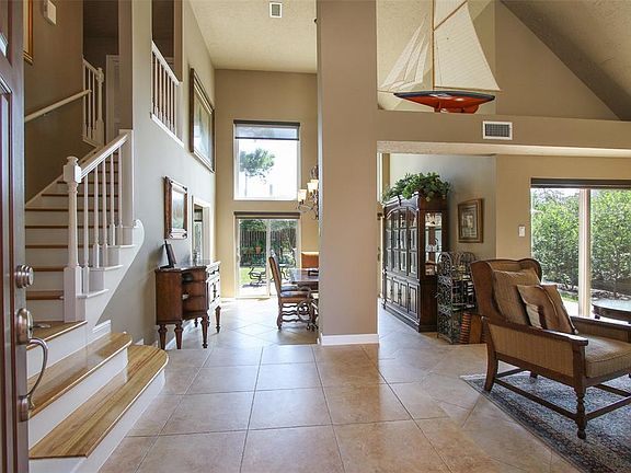 An entry you'll remember. Living room to the right, dining room straight ahead and an architectural WOW factor.