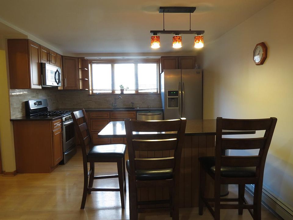 new kitchen with stainless steel appliances