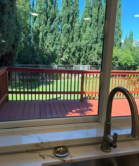 View from kitchen sink window to backyard