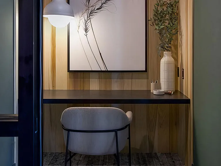 Private office area with desk and comfortable seating