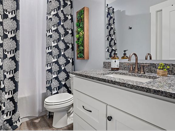 2nd BR ensuite/hall bath with tub and great water pressure. Eco-friendly, low flow toilet and 'always on" air exchange system.