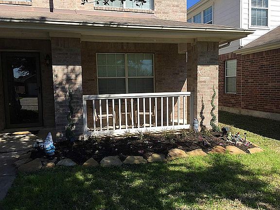 Front porch to enjoy your morning coffee with new landscaping