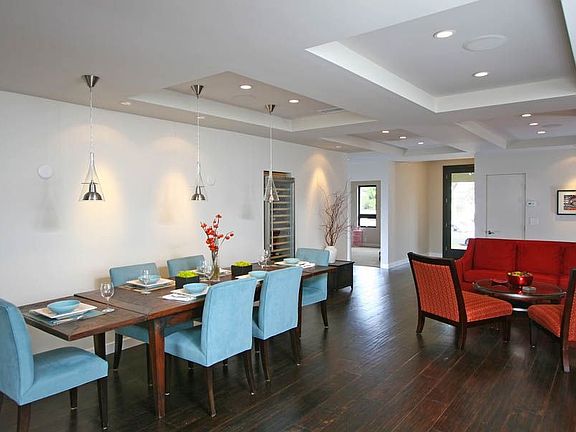 Dining room and sitting area adjoin this open and fluid floorplan design