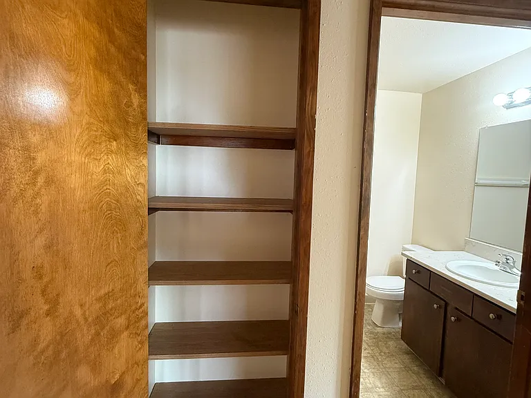 Linen closet and second bathroom.
