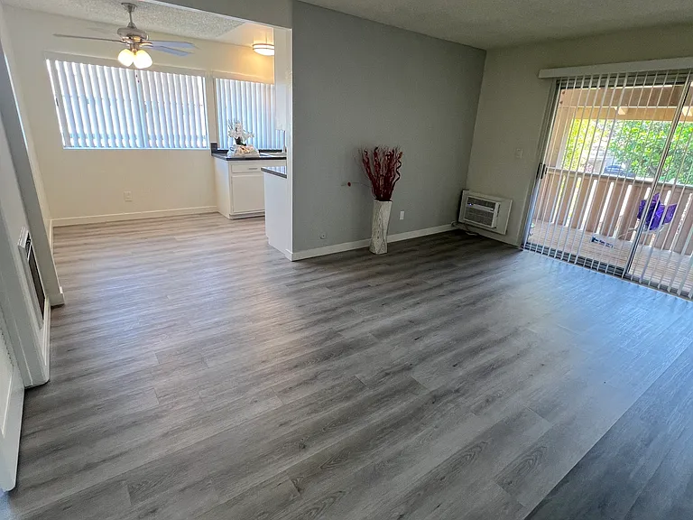 Living-room overseeing the balcony to the right and dining-room in front