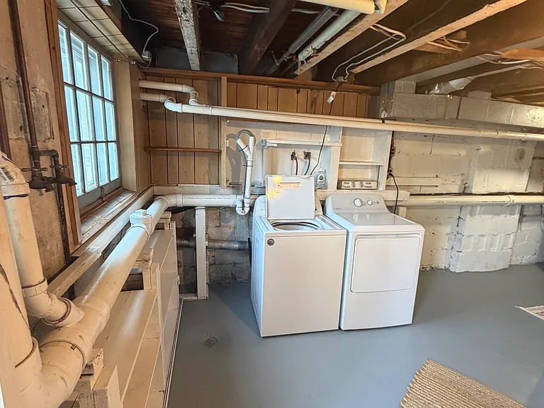 Washer & Dryer in Walkout level Basement. View from Back door