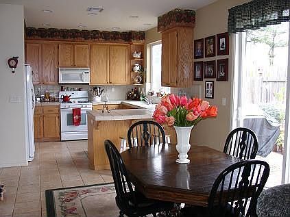 Dining area looking into open kitchen