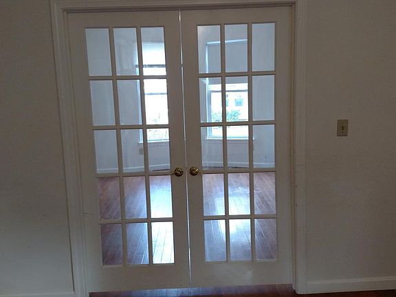 View from living room into bedroom. This bedroom is in the front of the house.