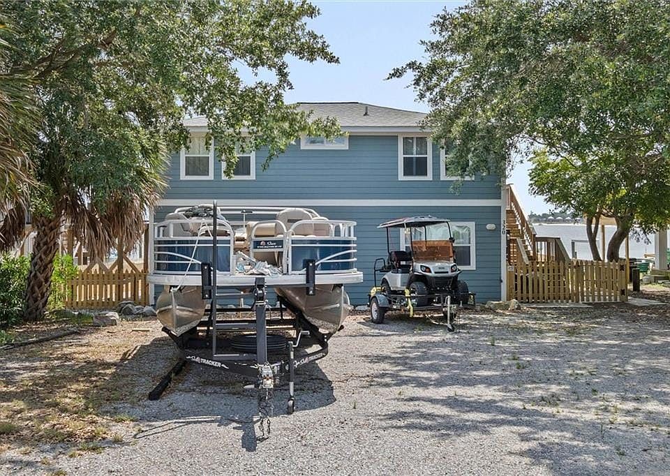 Two-story property with light blue horizontal siding