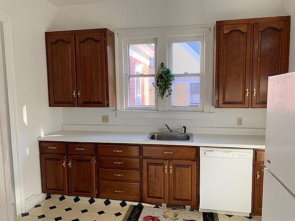 Kitchen has dishwasher, disposal, gas stove and refrigerator