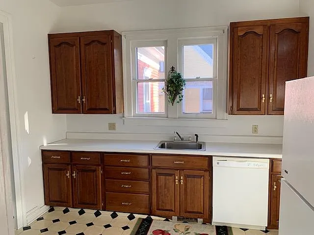 Kitchen has dishwasher, disposal, gas stove and refrigerator
