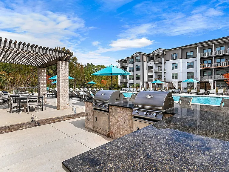 Experience upscale outdoor living with poolside relaxation and grilling stations at your fingertips.