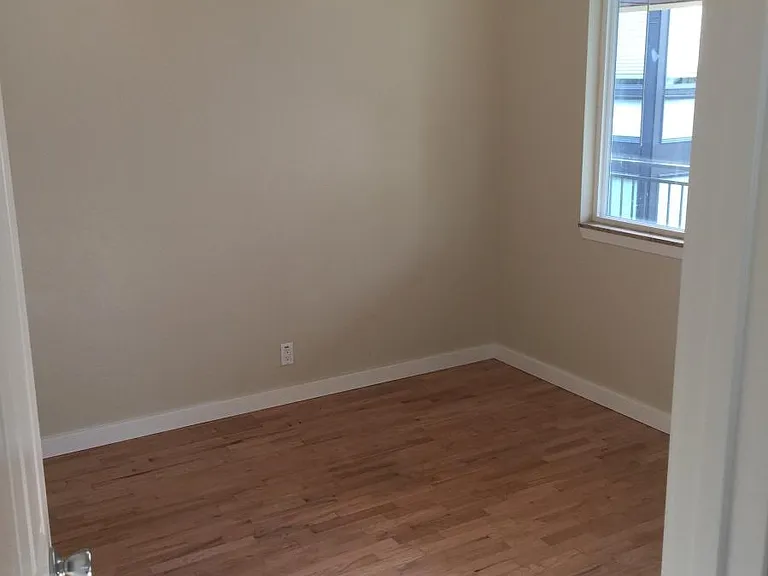 Bedrooms with ceiling fans and hardwood floors, and granite