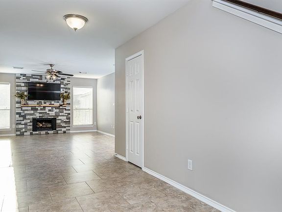 Open the door to this wonderfully updated home! Gorgeous tile flooring flows throughout most of the main living areas creating a seamless look.