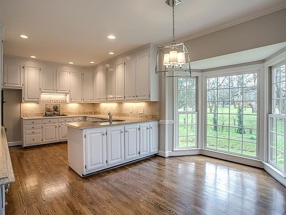 Beautiful Bay Window in Breakfast Room overlooks yard. What a beautiful view!