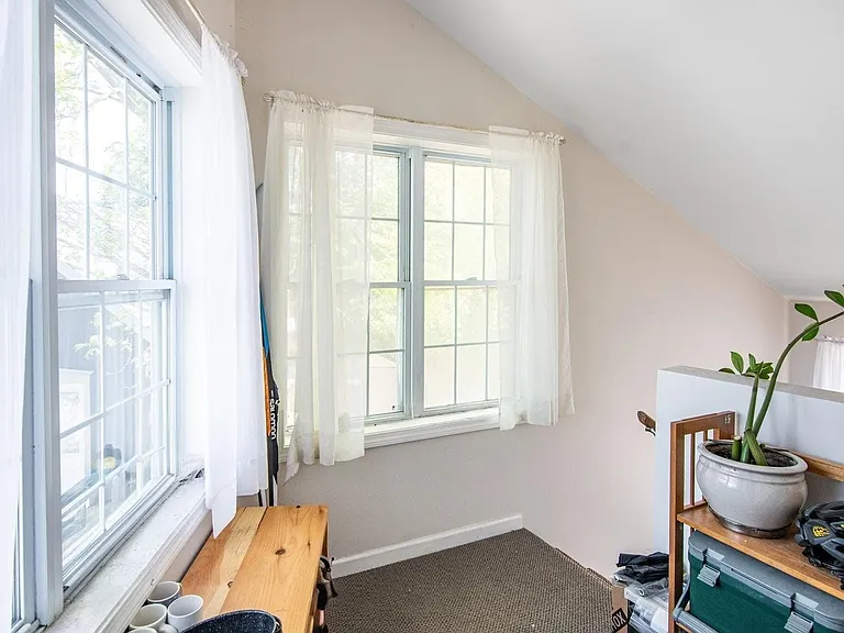Private entrance area with oversized sunny windows.