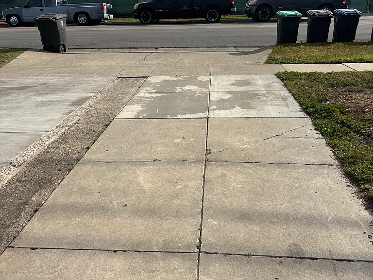 An extended driveway offering plenty of parking space at the front and back of the home.