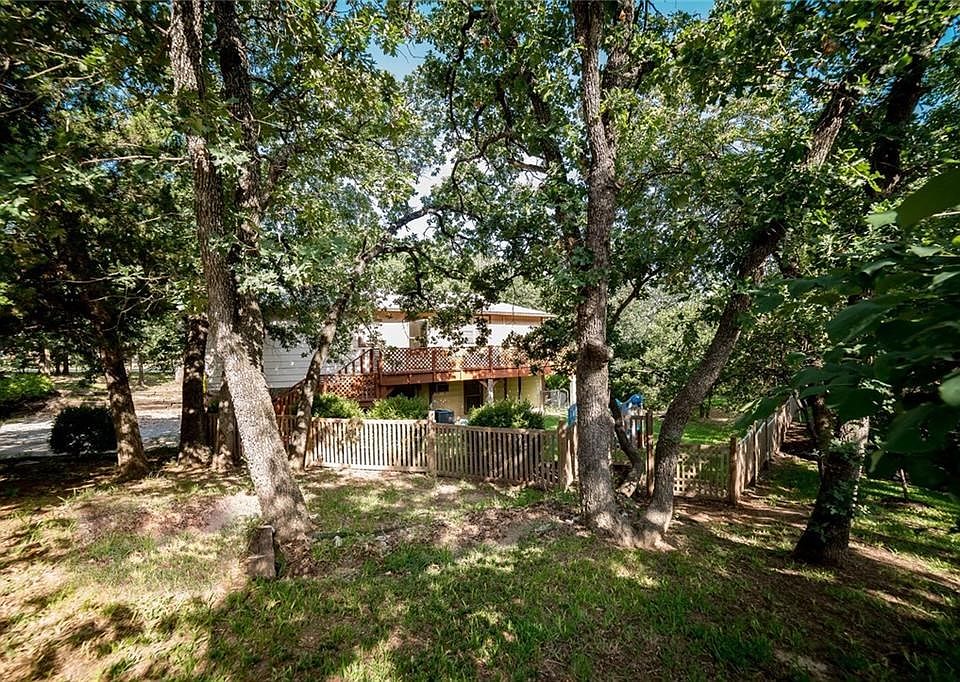 Heavily matured trees with plenty of grass on this oversized corner lot in Placid Peninsula subdivision with NO HOA.