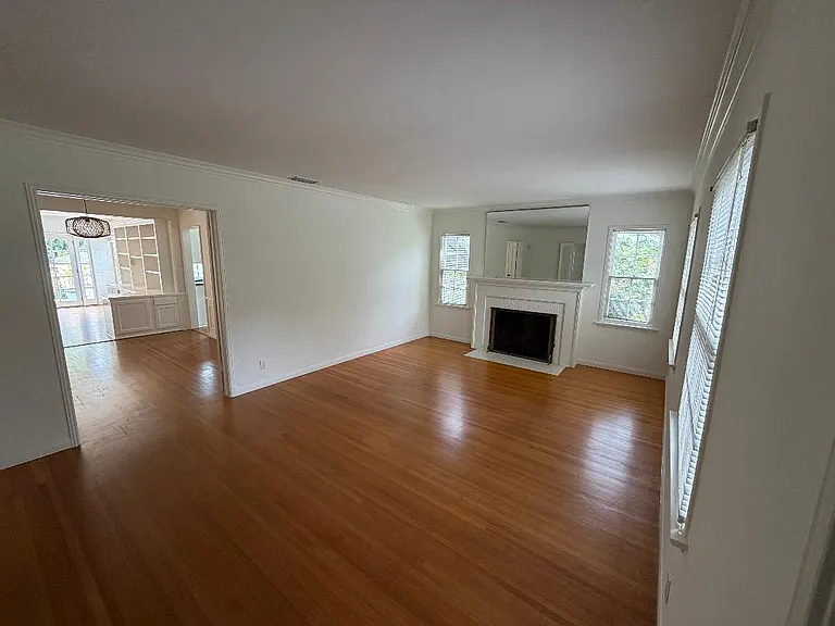 Living room with gas fireplace, access to dining room and bedrooms