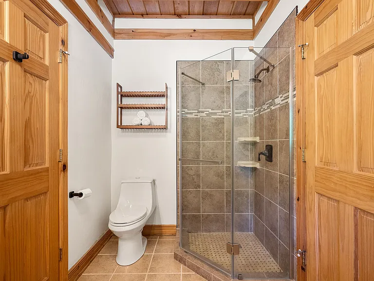 Main floor bathroom with glass shower surround.