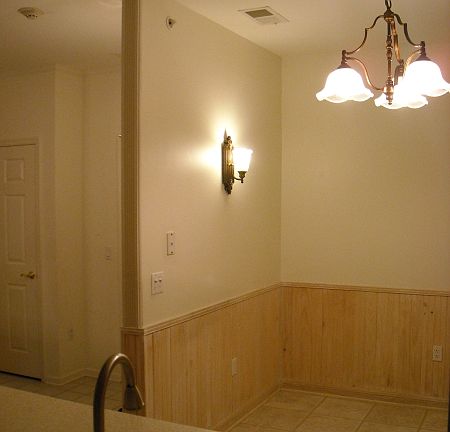 Wainscoting and new light fixtures and s.s. appliances complete the kitchen.