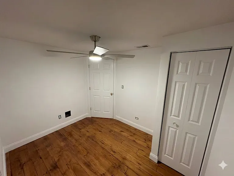 Secondary bedroom. 8' x 10.5'. With closet and two windows