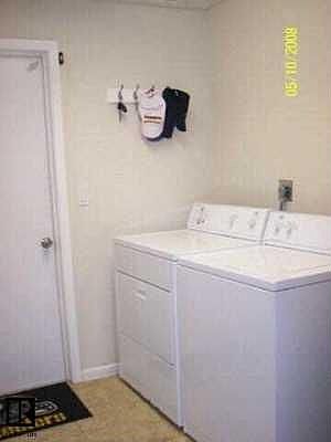 laundry room with storage closet