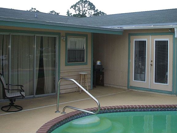 Back Patio. French doors from MBR.