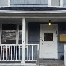 Outside picture of main house that sits in front of the detached MIL (for reference in locating the property).